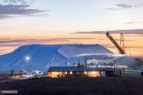 salt stockpiles at sunset - salt mineral stock pictures, royalty-free photos & images
