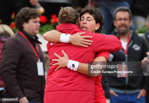 Carla Suarez of Spain celebrates the victory with Anabel Medina during her match against Misaki Doi of Japan during the Fed CUp, group round, played...