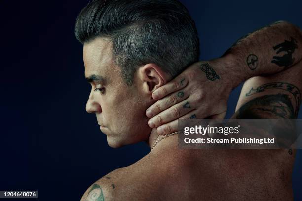 Singer-songwriter Robbie Williams is photographed for Attitude magazine on October 4, 2016 in London, England.