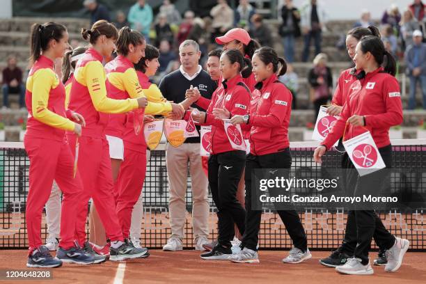 The team of Spain formed by Lara Arruabarrena, Aliona Bolsova, Sara Sorribes and Carla Suarez Navarro clashes hands with the team of Japan formed by...
