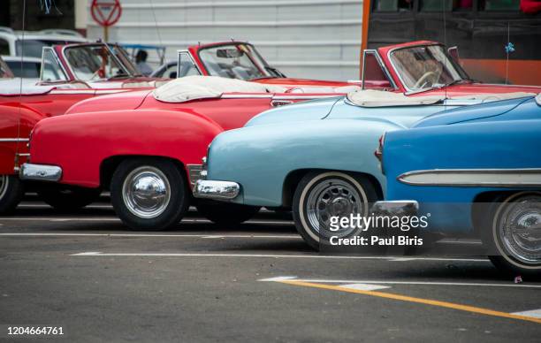 old american cars in a row on havana street, havana, cuba - classic car stock pictures, royalty-free photos & images