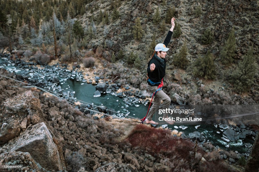 Young Adult Friends Extreme Highlining At Smith Rock Park