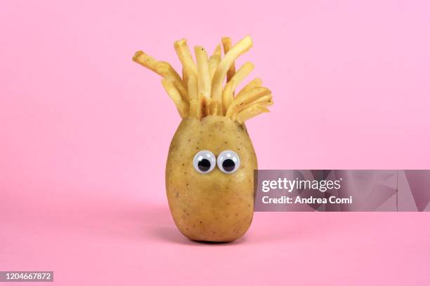 raw potato with french fries like hairs - google eyes stock pictures, royalty-free photos & images