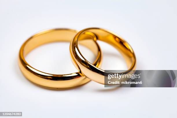 close-up of wedding rings - wedding ring stock pictures, royalty-free photos & images