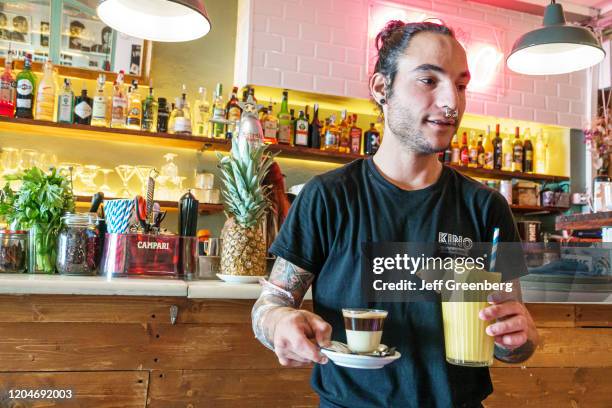 Barcelona, Kino Cafe, restaurant waiter carrying drinks.