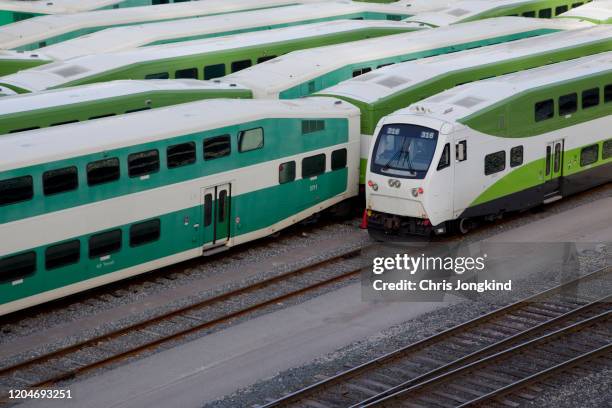 commuter passenger trains lined up in a rail yard - toronto transit stock pictures, royalty-free photos & images