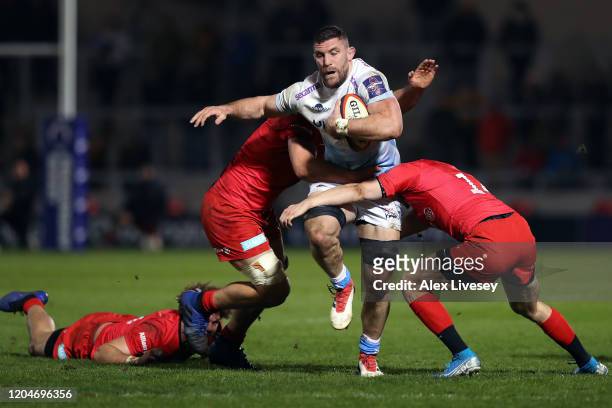Mark Wilson of Sale Sharks is tackled by Ali Crossdale and Callum Hunter-Hill of Saracens during the Premiership Rugby Cup Semi-Final match between...
