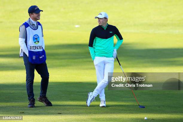 Matthew Fitzpatrick of England talks with his caddie during the second round of the AT&T Pebble Beach Pro-Am at Spyglass Hill Golf Course on February...