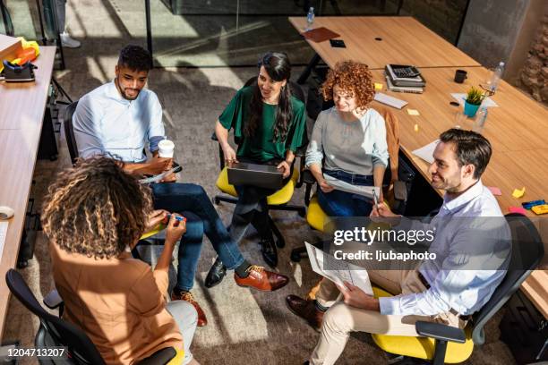 ambitious african black female employee speaking at diverse meeting - suspicion employee stock pictures, royalty-free photos & images