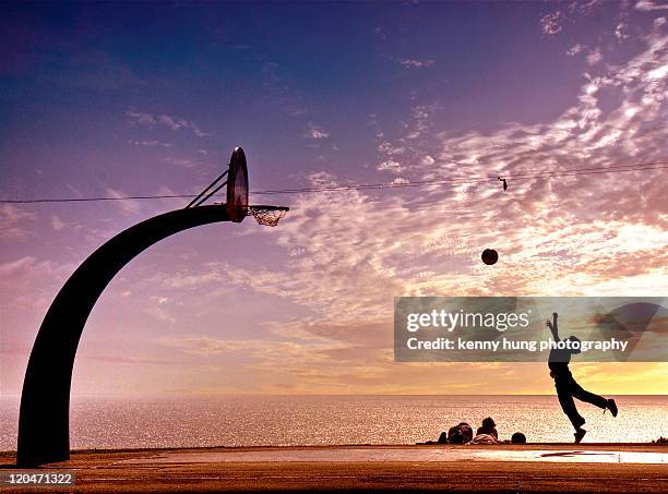 boy throwing ball in basket - san pedro los angeles stock pictures, royalty-free photos & images
