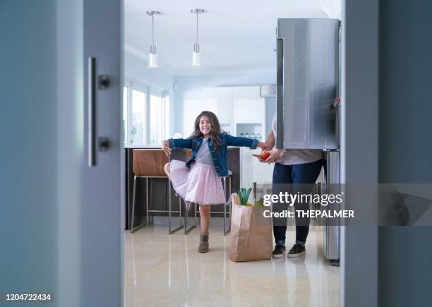 helping mom and dancing is all good - funny fridge stock pictures, royalty-free photos & images