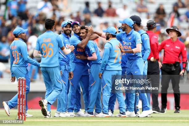 Yuzvendra Chahal of India celebrates the wicket of Mark Chapman of the Black Caps with Virat Kohli and his team during game two of the One Day...