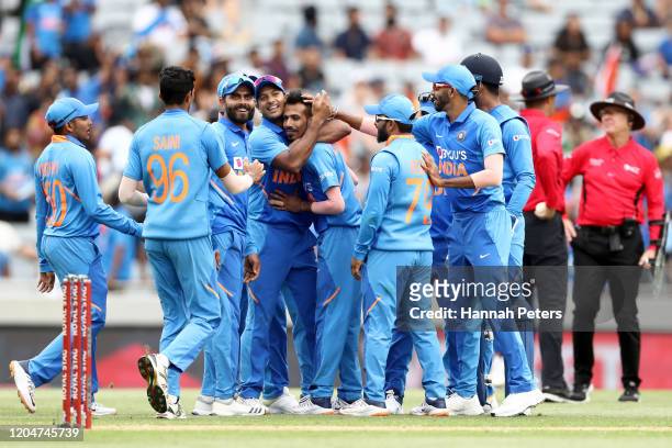 Yuzvendra Chahal of India celebrates the wicket of Mark Chapman of the Black Caps with Virat Kohli and his team during game two of the One Day...