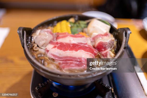 japanese sukiyaki on the table - sukiyaki stock-fotos und bilder