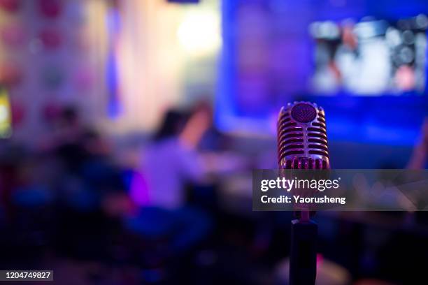 close up of microphone in concert hall - asia broadcast stock pictures, royalty-free photos & images