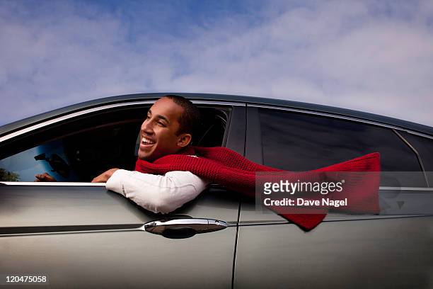 a man driving his car, scarf blowing - new car stock pictures, royalty-free photos & images