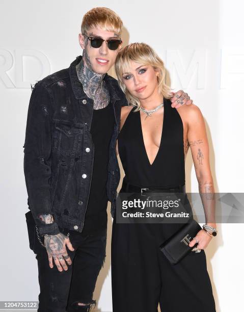Trace Cyrus and Miley Cyrus arrives at the Tom Ford AW20 Show at Milk Studios on February 07, 2020 in Hollywood, California.