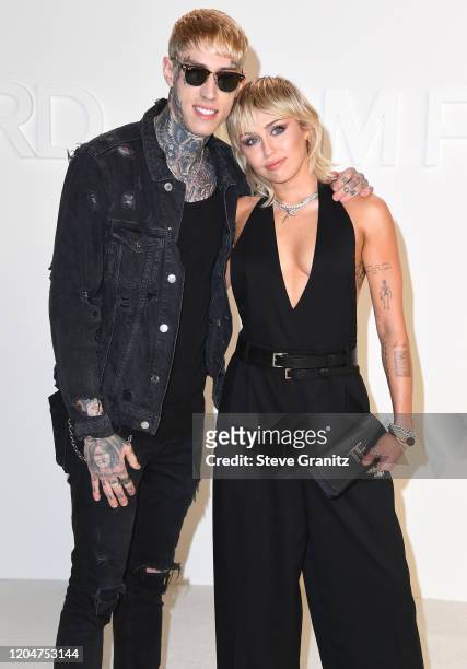 Trace Cyrus and Miley Cyrus arrives at the Tom Ford AW20 Show at Milk Studios on February 07, 2020 in Hollywood, California.