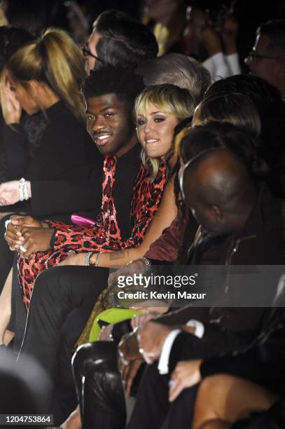 Miley Cyrus and Lil Nas X attend the Tom Ford AW20 Show at Milk Studios on February 07, 2020 in Hollywood, California.