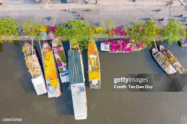 vietnam, ho chi minh city - the binh dong wharf floating market in tau hu canal in hcm city district 8, high quality aerial view - vietnam market stock pictures, royalty-free photos & images