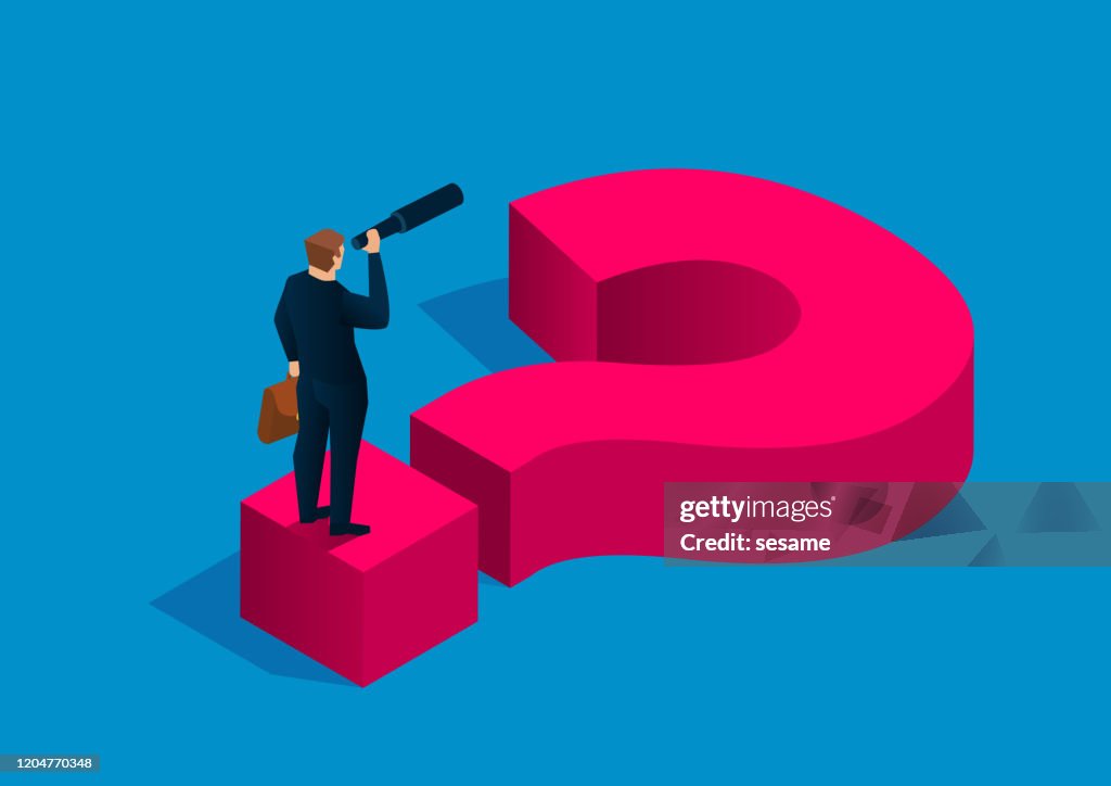 Solving business problems, businessman holding binoculars standing on question mark