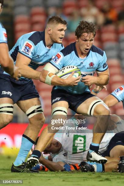 Michael Hooper of the Waratahs attempts a try during the round 2 Super Rugby match between the Waratahs and the Blues at McDonald Jones Stadium on...