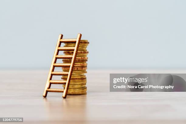 ladder on stack of coins - income stock pictures, royalty-free photos & images