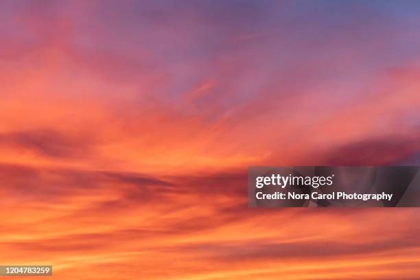 vibrant and colorful sunset background - red cloud sky stock pictures, royalty-free photos & images