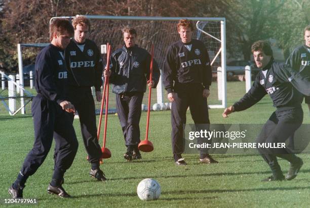 French team trainer of the "Girondins de Bordeaux" L1 squad , Aimé Jacquet, gestures during a training session, 21 november 1988. From left: Yannick...