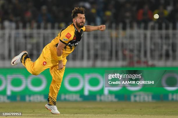 Peshawar Zalmi's Yasir Shah delivers the ball during the Pakistan Super League T20 cricket match between Peshawar Zalmi and Karachi Kings at the...