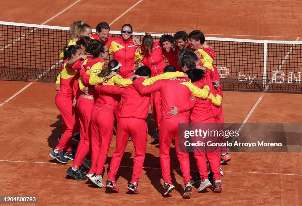 Carla Suarez Navarro of Spain celebrates with her coach Anabel Medina and all the Spanish team after their qualification to Budapest after Carla´s...