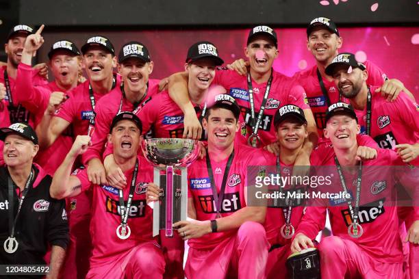 The Sixers pose with the trophy after winning the Big Bash League Final match between the Sydney Sixers and the Melbourne Stars at the Sydney Cricket...