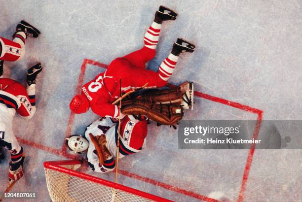 Winter Olympics: Aerial view of Team USSR Vladimir Krutov laying on USA goalie Jim Craig during Medal Round game vs at Olympic Fieldhouse in the...