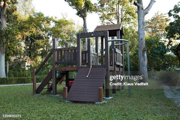 slide at tourist resort - climbing frame stock pictures, royalty-free photos & images