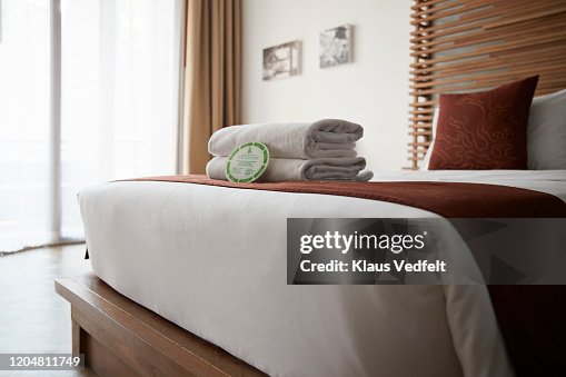 Towels on bed in hotel room Towels on bed in hotel room