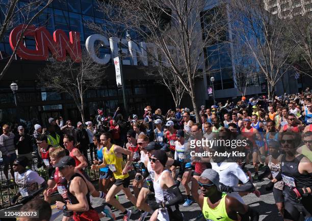 The men's race runs past the CNN Center at the start of the U.S. Olympic marathon team trials on February 29, 2020 in Atlanta, Georgia.
