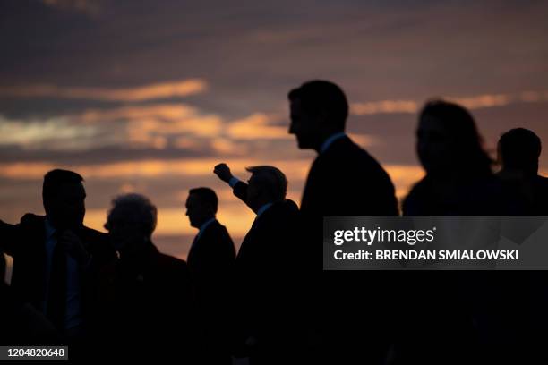 President Donald Trump gestures as he arrives at Douglas International Airport March 2 in Charlotte, North Carolina. - US President Donald Trump...