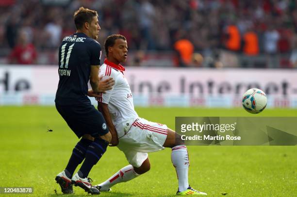 Tunay Torun of Berlin and Timothy Chandler of Nuernberg battle for the ball during the Bundesliga match between Hertha BSC Berlin and 1. FC Nuernberg...