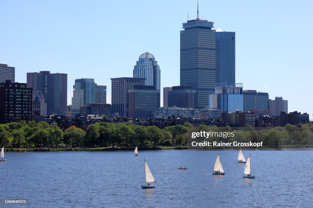 Small sailboats on Charles River with 200 Clarendon, former John Hancock Tower and other skyscrapers in background