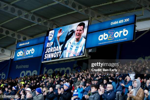Fans applaud on the 25th minute in a tribute to Jordan Sinnott during the Sky Bet Championship match between Huddersfield Town and Queens Park...