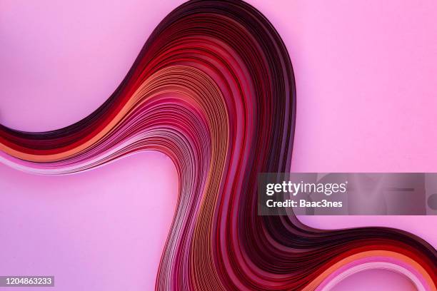 curved paper on pink background - twisted stock pictures, royalty-free photos & images