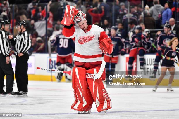 Goaltender Jimmy Howard of the Detroit Red Wings takes a breather against the Columbus Blue Jackets on February 7, 2020 at Nationwide Arena in...