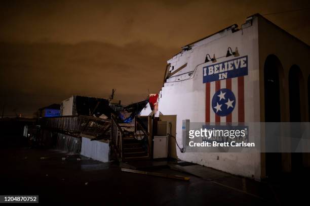 General view of a mural on heavily damaged The Basement East in the East Nashville neighborhood on March 3, 2020 in Nashville, Tennessee. A tornado...
