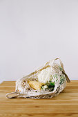 fresh corn and cauliflower in an eco bag on a wooden table Save planet