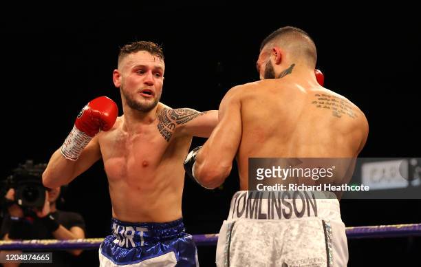 Stewart Burt punches Anthony Tomlinson during the British and Commonwealth Welterweight Title Eliminator fight between Anthony Tomlinson and Stewart...