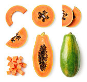 Set of fresh whole and half papaya fruit and slices