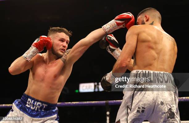 Stewart Burt punches Anthony Tomlinson during the British and Commonwealth Welterweight Title Eliminator fight between Anthony Tomlinson and Stewart...