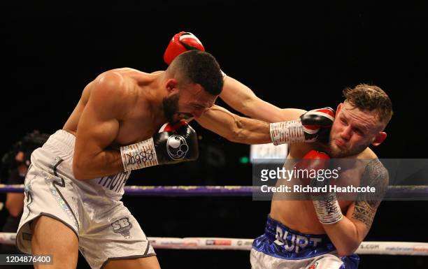 Anthony Tomlinson and Stewart Burt exchange punches during the British and Commonwealth Welterweight Title Eliminator fight between Anthony Tomlinson...
