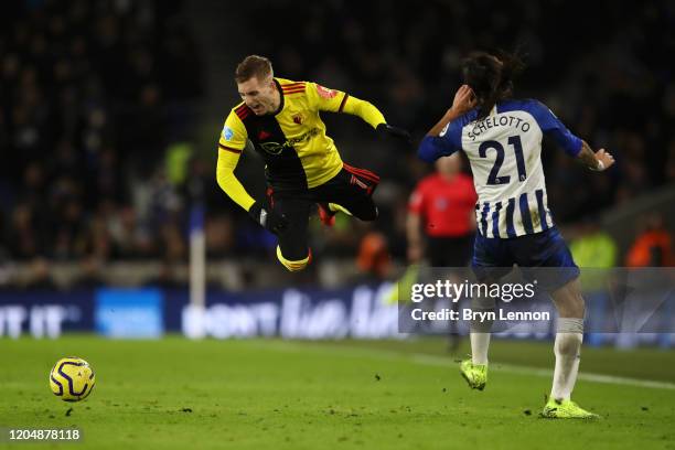 Gerard Deulofeu of Watford clashes with Ezequiel Schelotto of Brighton and Hove Albion during the Premier League match between Brighton & Hove Albion...