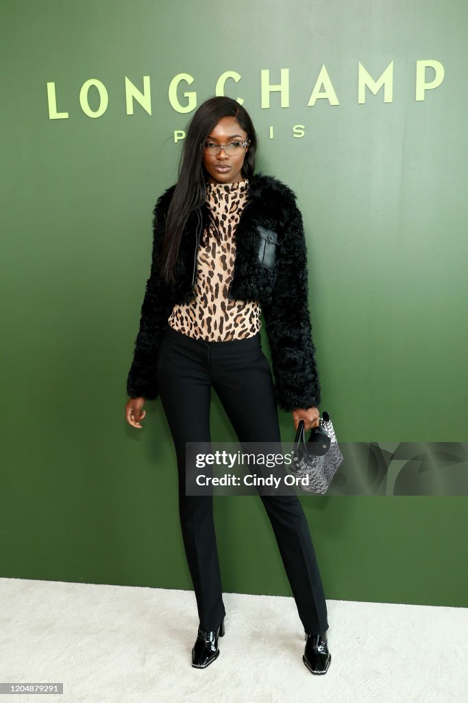 Leomie Anderson attends the Longchamp fashion show during February